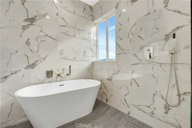 a bathroom with a bathtub and sink