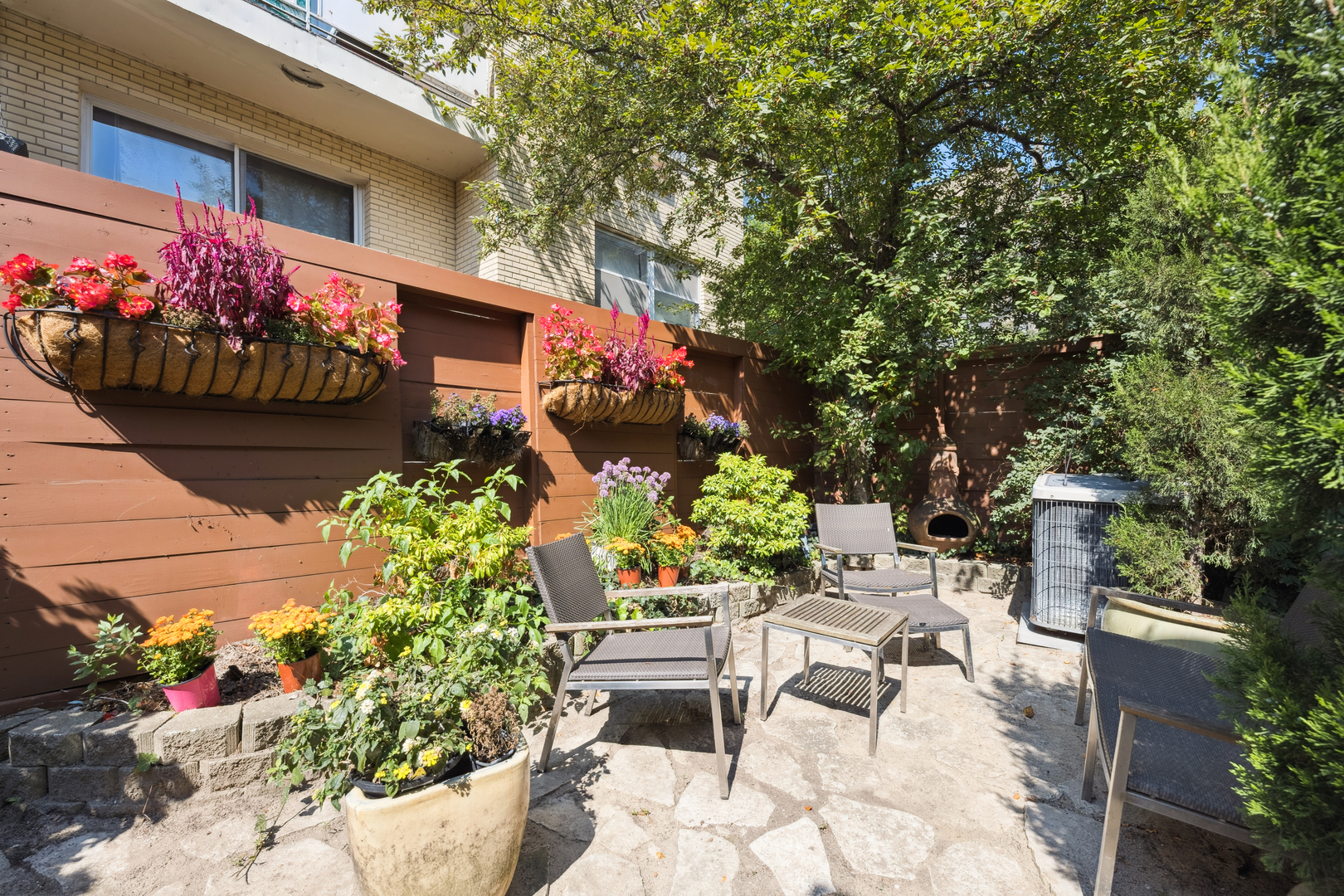524 West Barry Avenue Chicago, IL 60657 - Photo 7 of 39 a view of a chairs and table in a backyard
