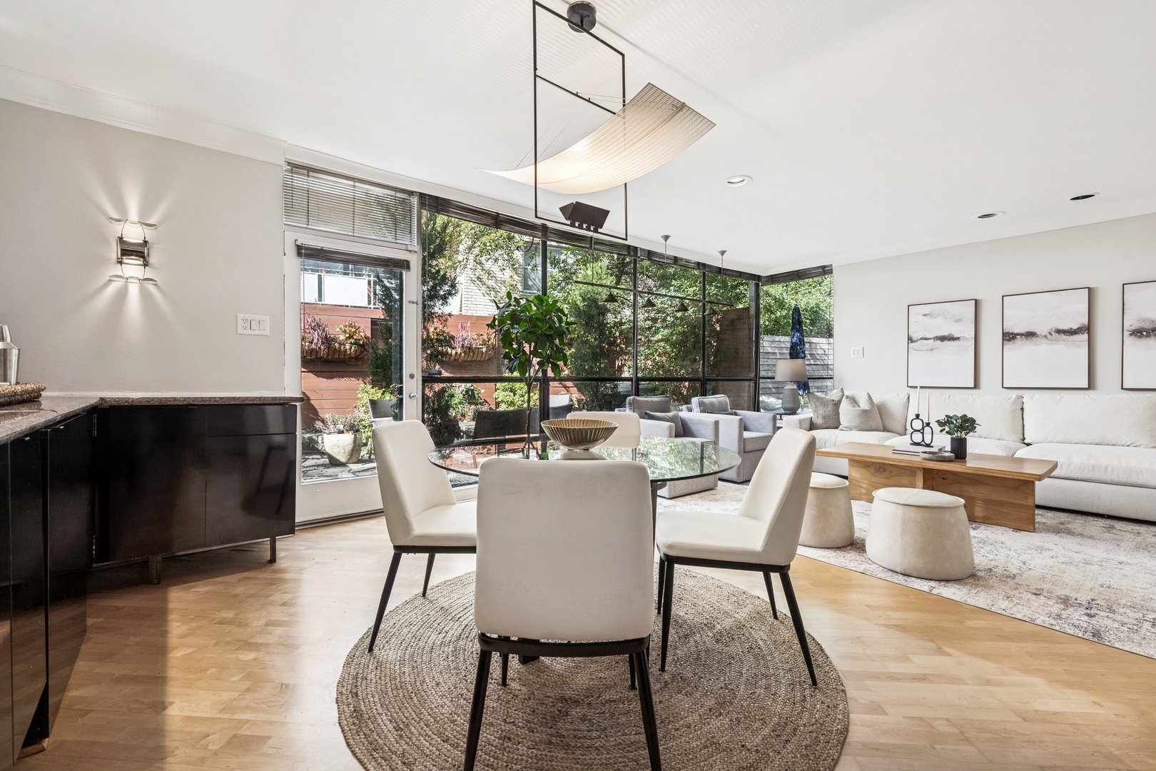 524 West Barry Avenue Chicago, IL 60657 - Photo 9 of 39 a dining room with furniture a chandelier and wooden floor