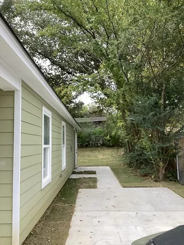 a view of a back yard of the house