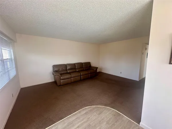 a view of room with window and stairs