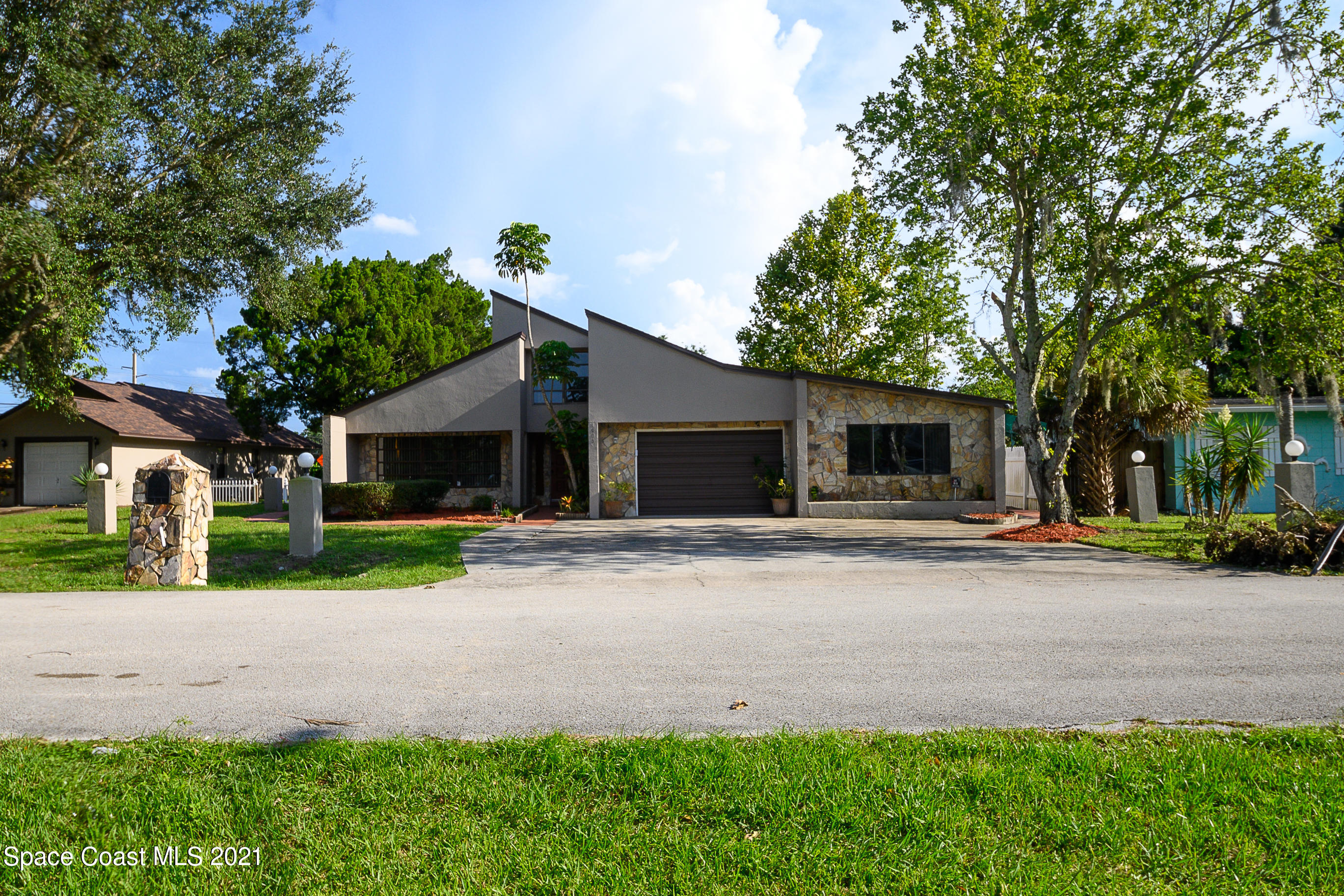 1003 Bernice Road Rockledge, FL 32955 - Photo 3 of 43 a front view of house with yard and green space