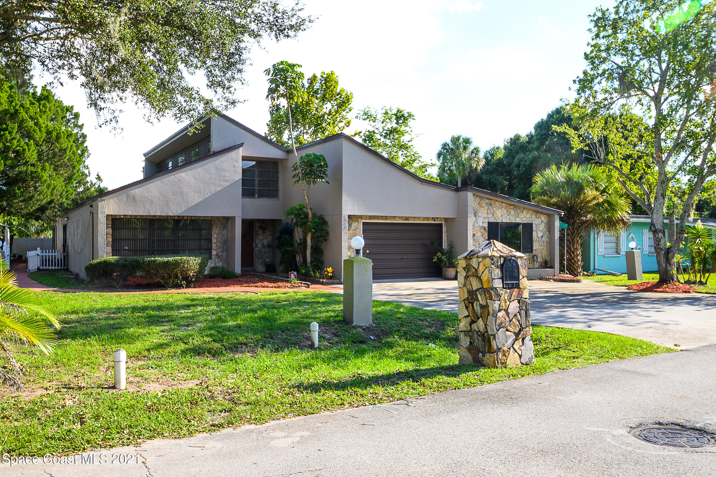 1003 Bernice Road Rockledge, FL 32955 - Photo 33 of 43 a front view of house with yard and green space