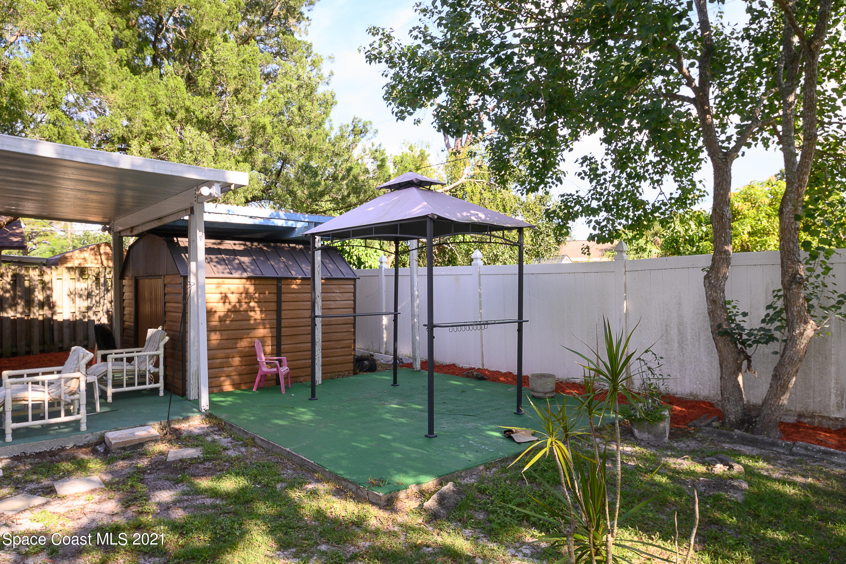 1003 Bernice Road Rockledge, FL 32955 - Photo 40 of 43 a view of a backyard with plants