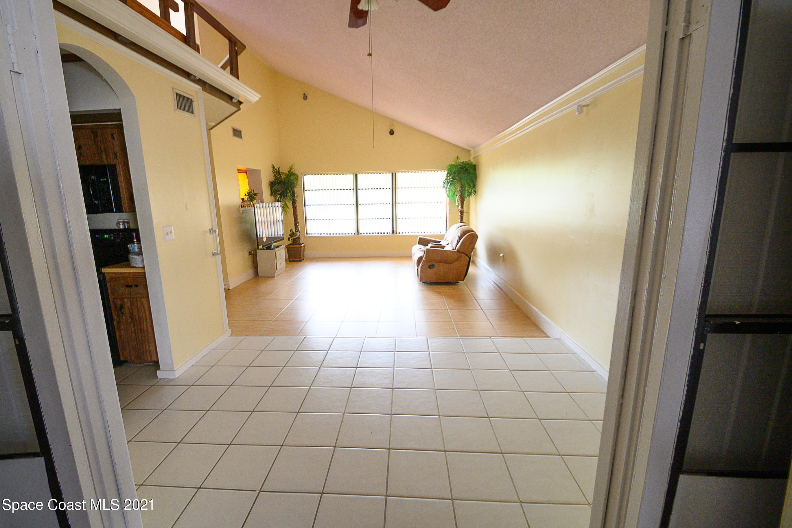 1003 Bernice Road Rockledge, FL 32955 - Photo 6 of 43 a view of an entryway and livingroom