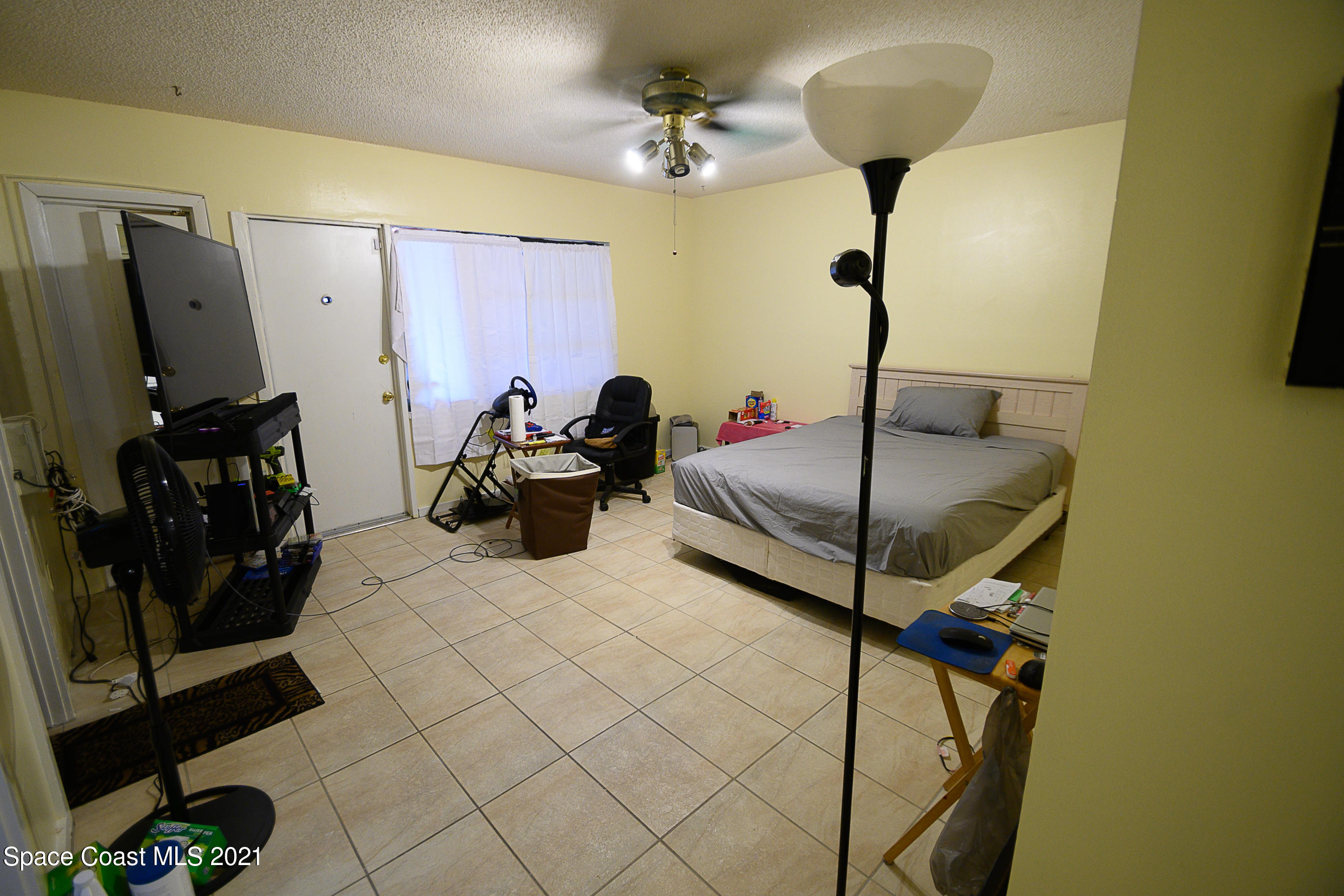 1003 Bernice Road Rockledge, FL 32955 - Photo 9 of 43 a bedroom with bed and window