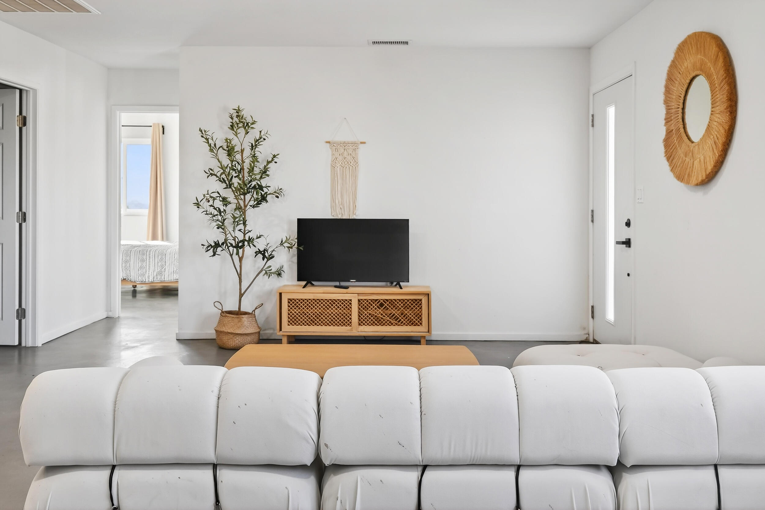 2071 Border Avenue Joshua Tree, CA 92252 - Photo 11 of 50 a bedroom with a bed and a chair