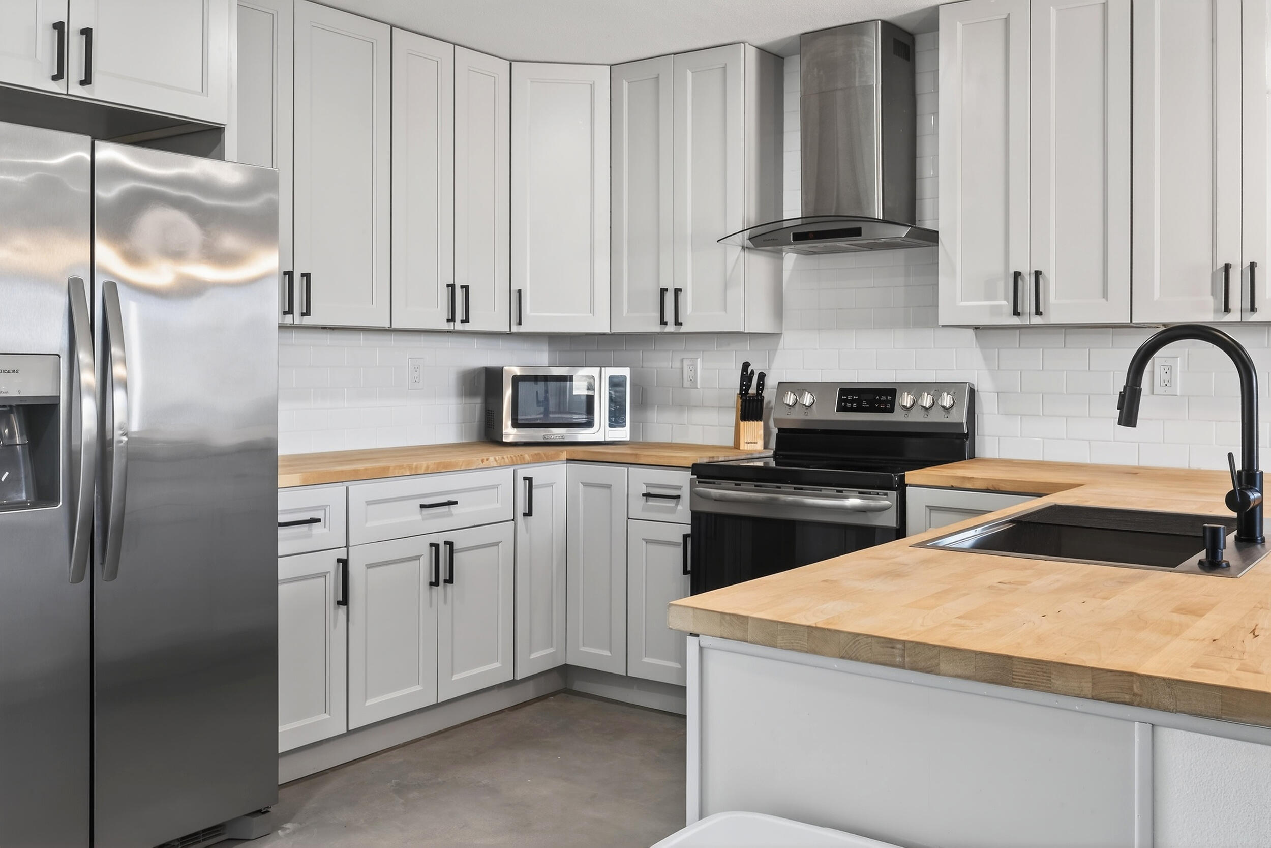 2071 Border Avenue Joshua Tree, CA 92252 - Photo 13 of 50 a kitchen with cabinets appliances and a counter space