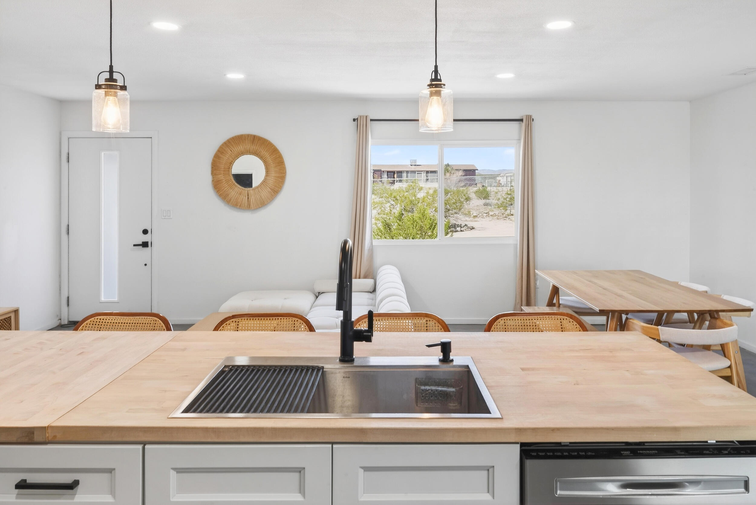 2071 Border Avenue Joshua Tree, CA 92252 - Photo 14 of 50 a view of kitchen with kitchen island stainless steel appliances sinks stove and refrigerator