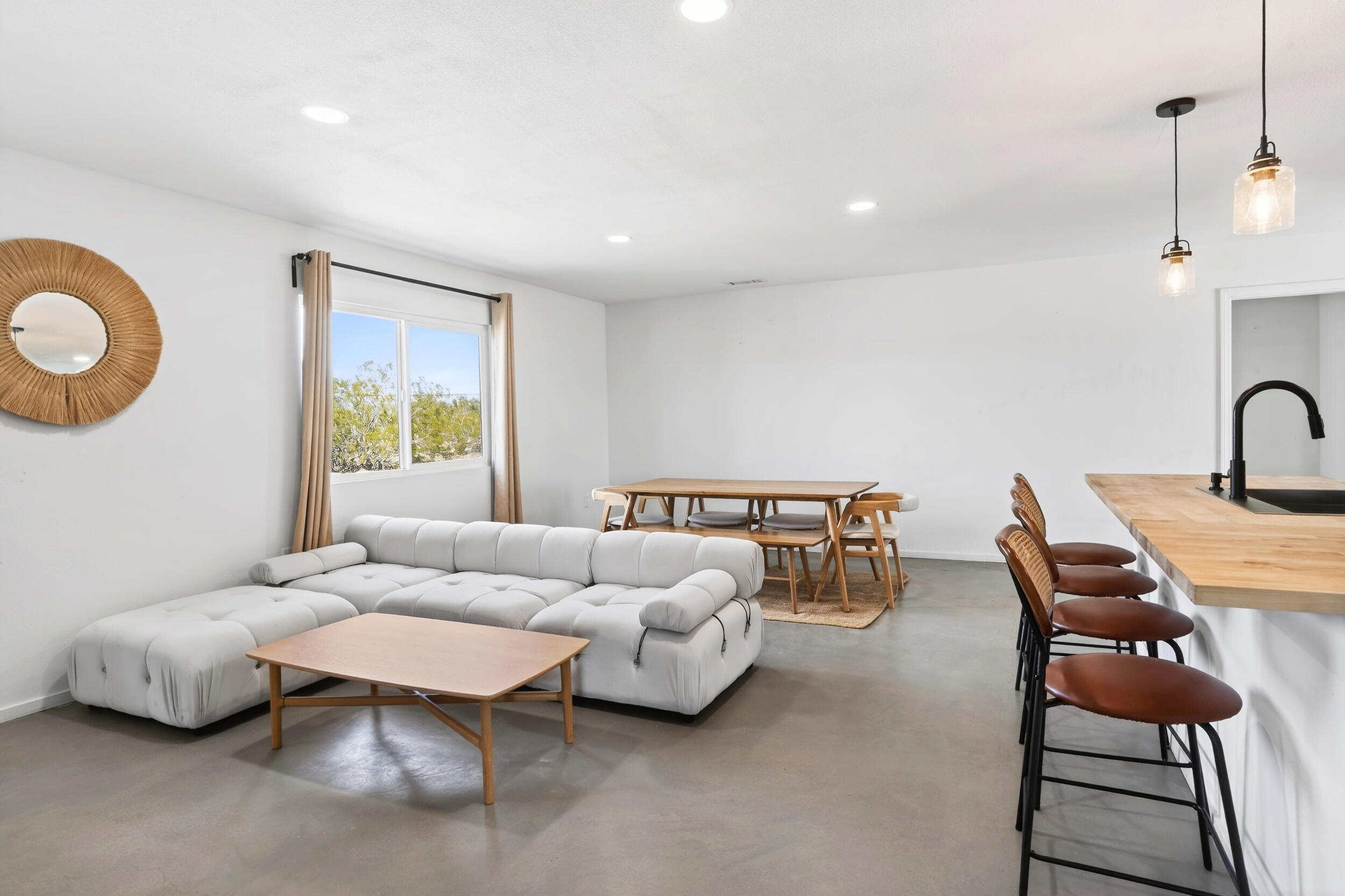 2071 Border Avenue Joshua Tree, CA 92252 - Photo 17 of 50 a living room with furniture and a window