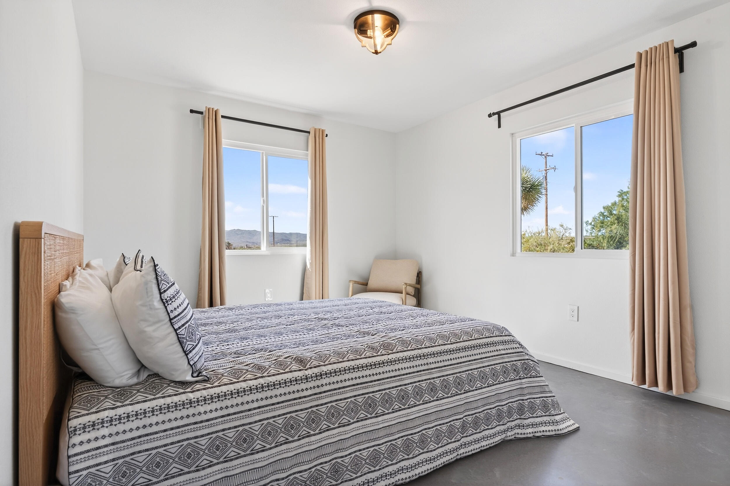 2071 Border Avenue Joshua Tree, CA 92252 - Photo 27 of 50 a bedroom with a bed and a window