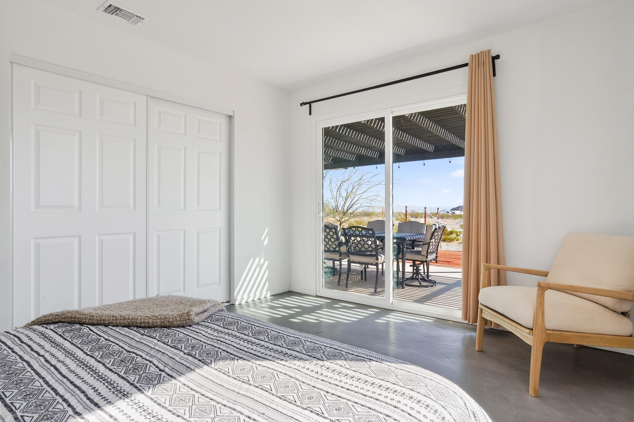 2071 Border Avenue Joshua Tree, CA 92252 - Photo 29 of 50 a bedroom with a bed and a window