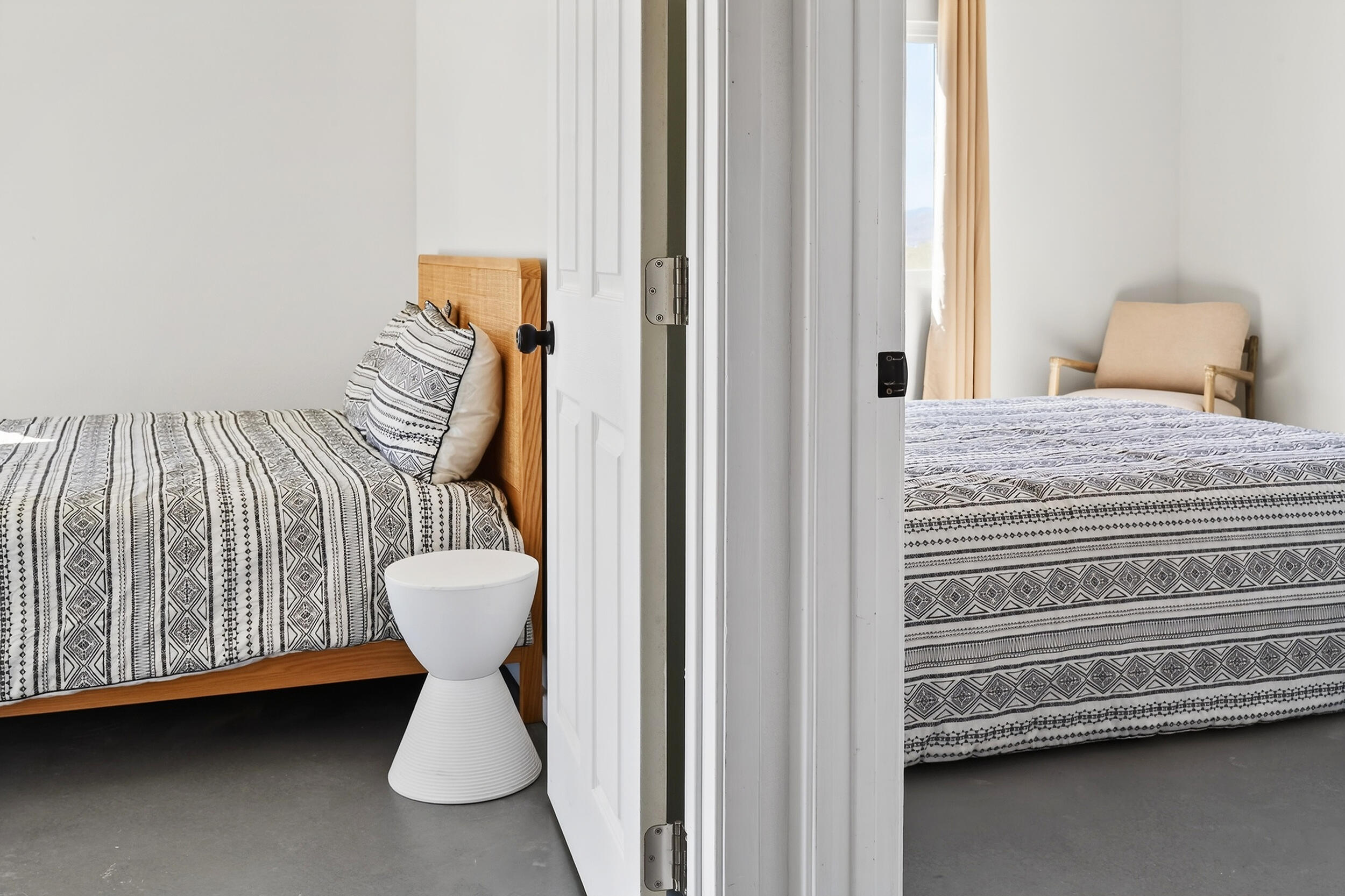 2071 Border Avenue Joshua Tree, CA 92252 - Photo 30 of 50 a bedroom with a bed and chair