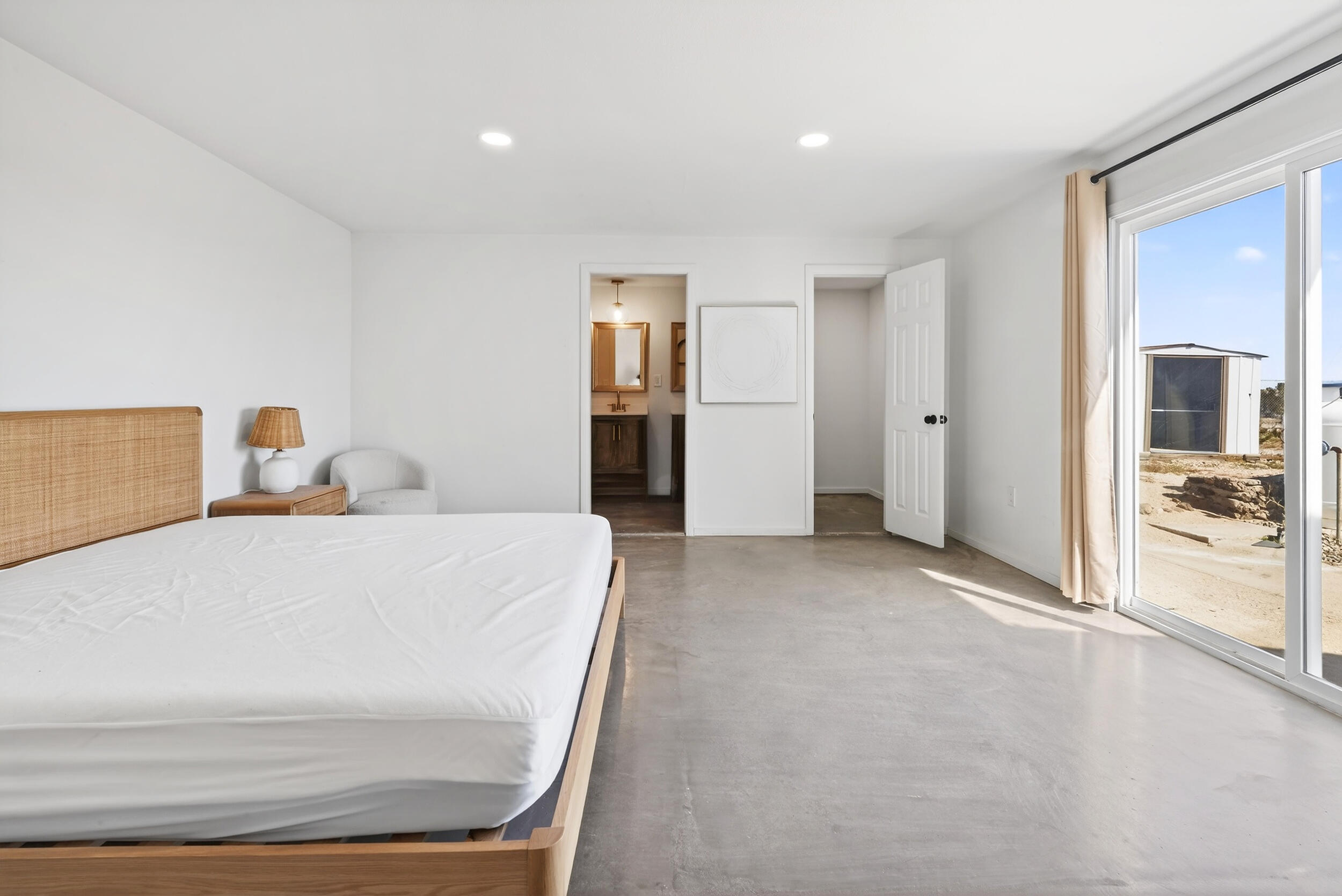 2071 Border Avenue Joshua Tree, CA 92252 - Photo 32 of 50 a large white bed in a white room