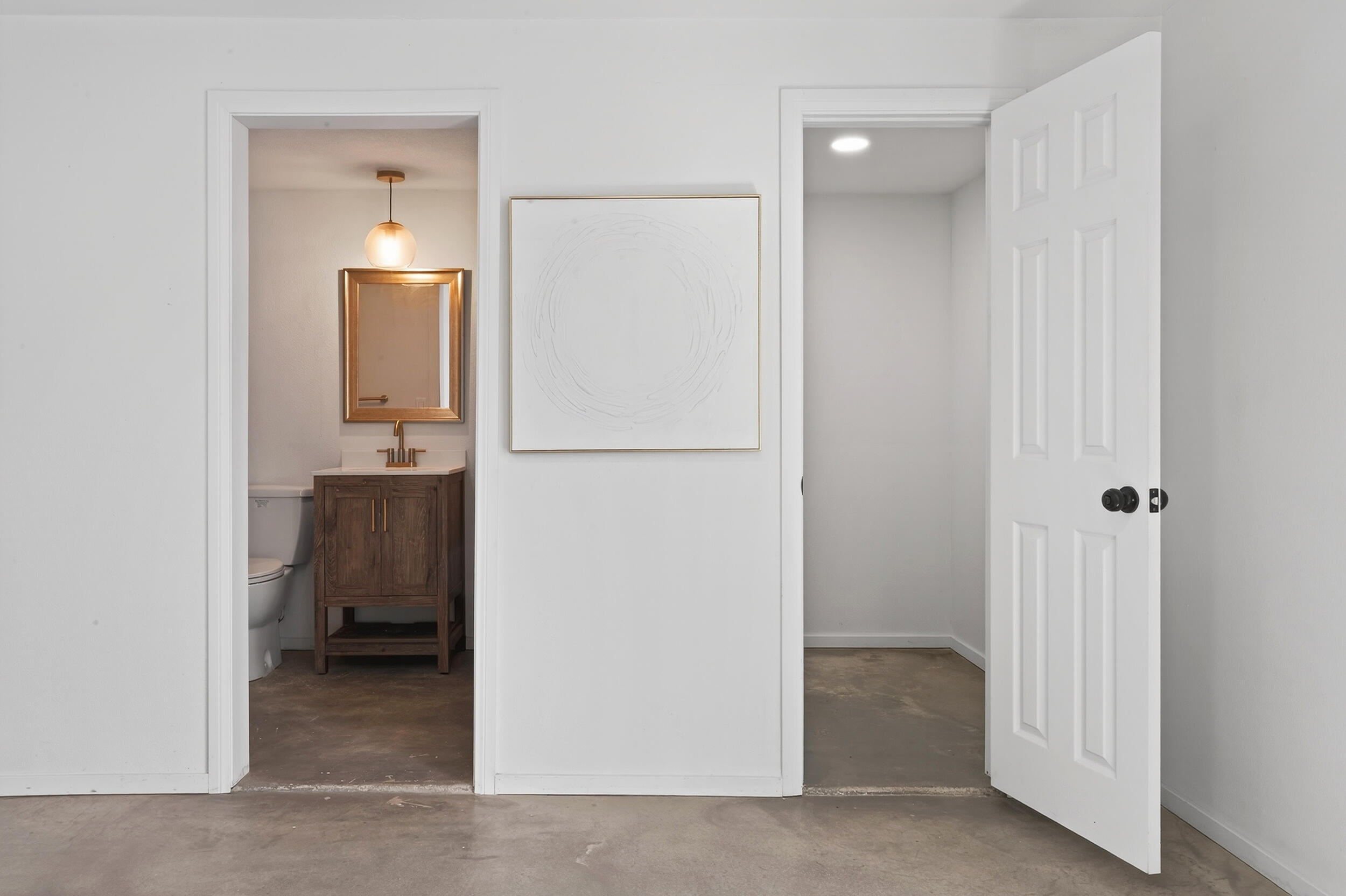 2071 Border Avenue Joshua Tree, CA 92252 - Photo 34 of 50 a view of a hallway with closet and a bathroom