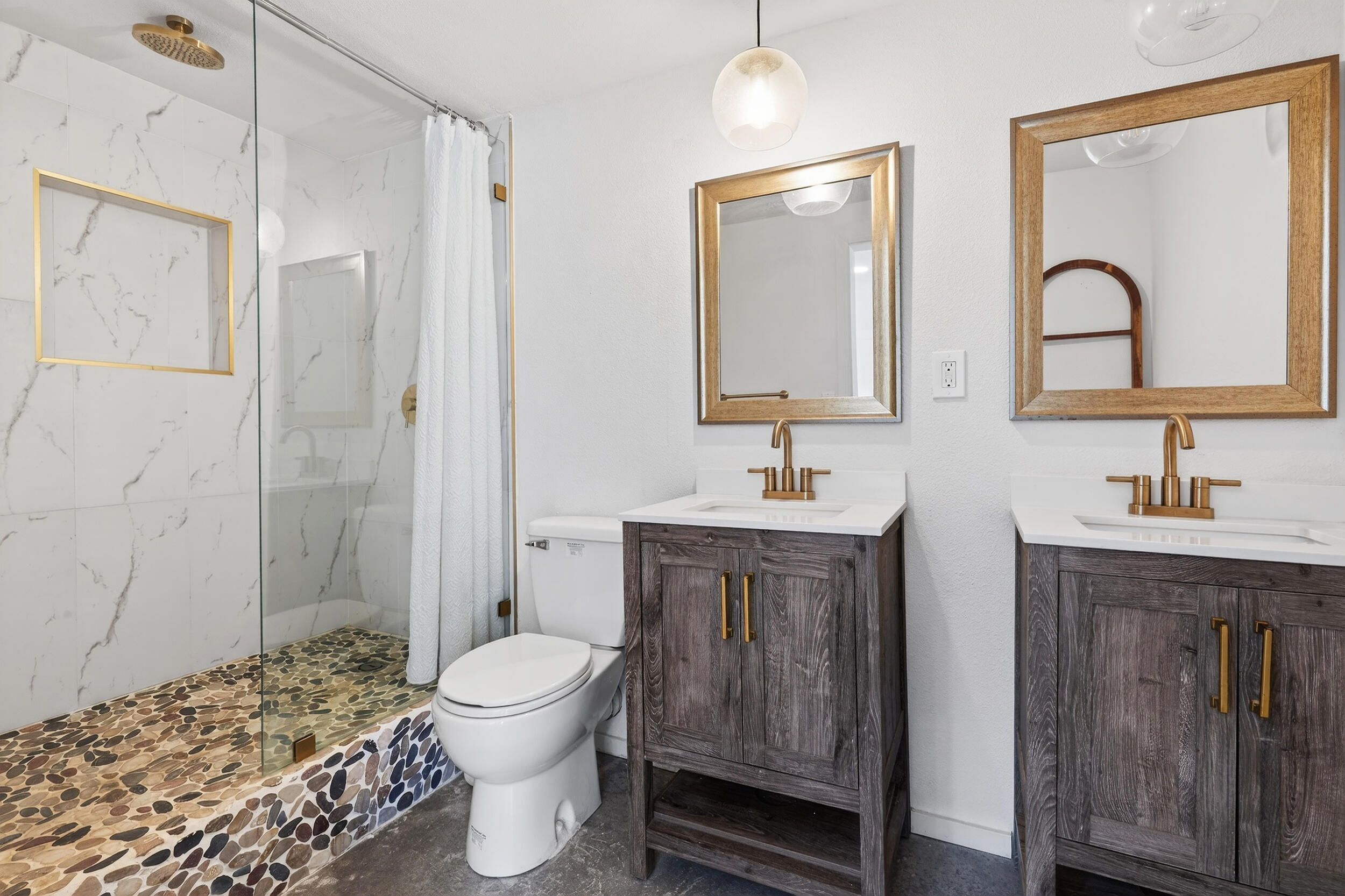 2071 Border Avenue Joshua Tree, CA 92252 - Photo 37 of 50 a bathroom with a double vanity sink toilet and shower