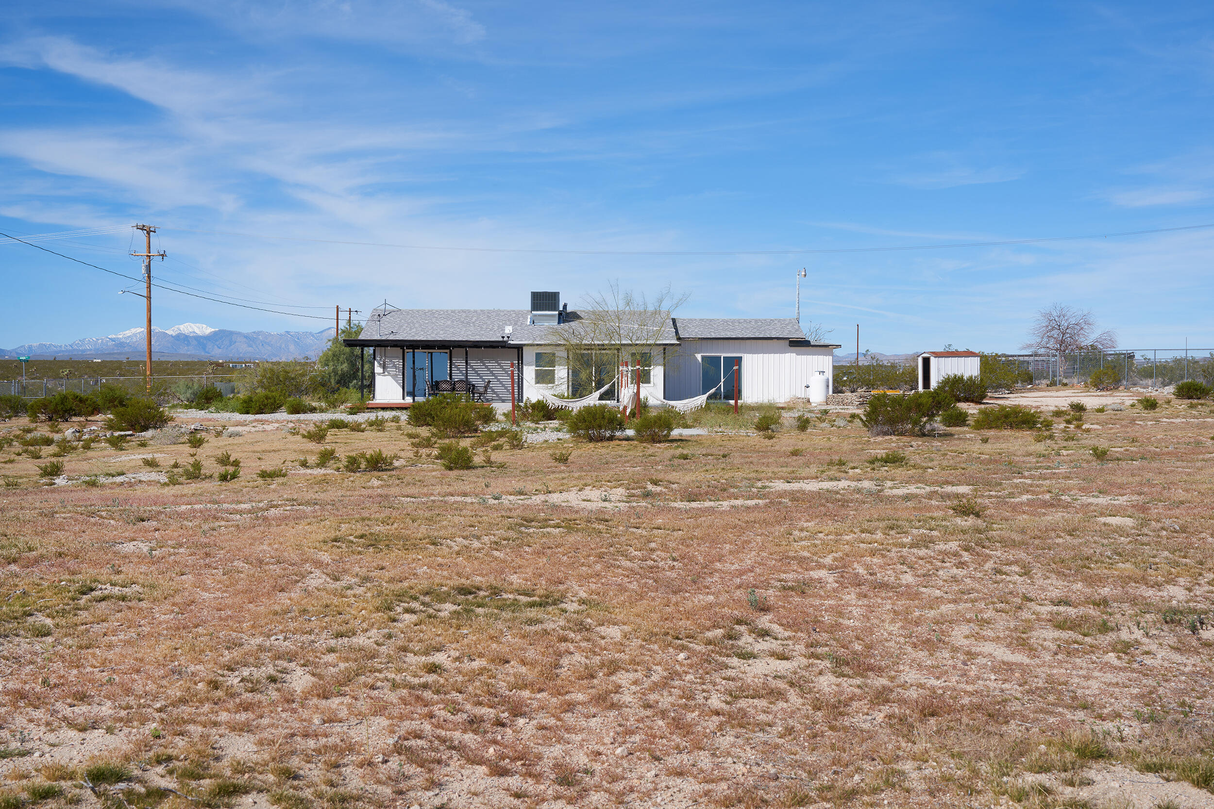 2071 Border Avenue Joshua Tree, CA 92252 - Photo 47 of 50 a view of a house with a yard and sitting area
