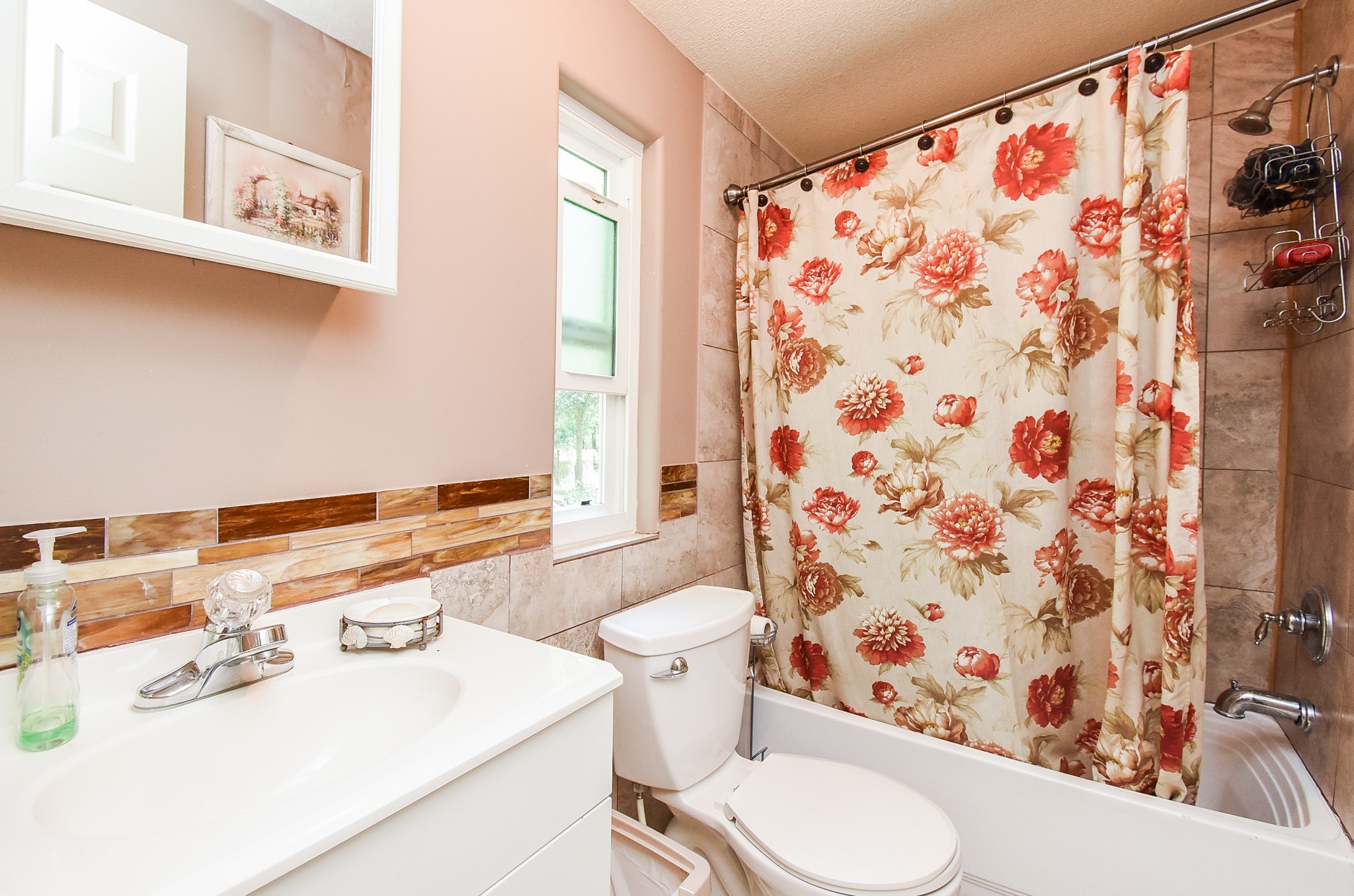 39551 Donigan Road Brookshire, TX 77423 - Photo 24 of 37 Full bathroom with shower / bathtub combination with curtain, vanity, and tile walls