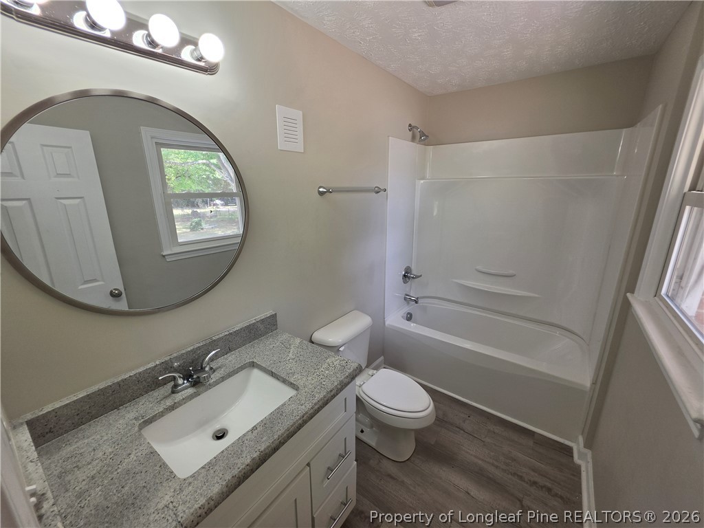 220 Cecil Avenue Spring Lake, NC 28390 - Photo 13 of 21 a bathroom with a sink toilet and shower