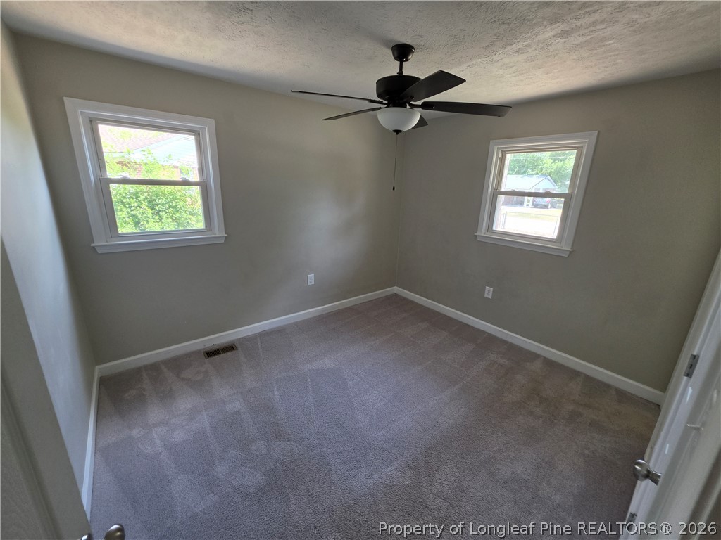 220 Cecil Avenue Spring Lake, NC 28390 - Photo 15 of 21 a view of an empty room with a window