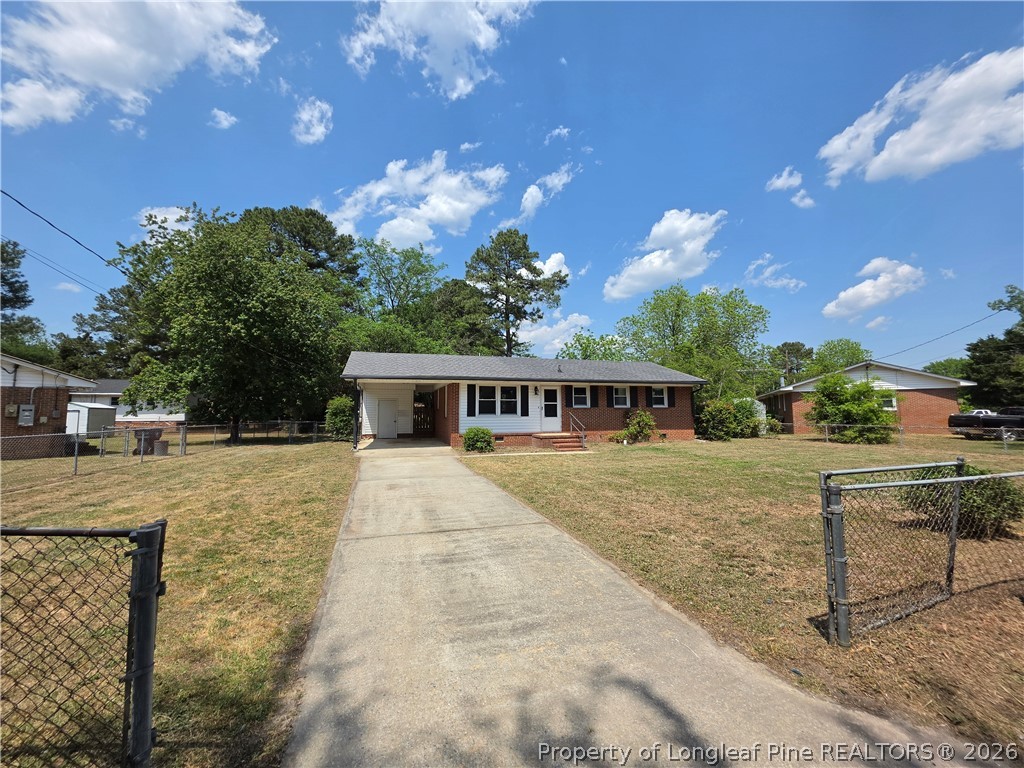 220 Cecil Avenue Spring Lake, NC 28390 - Photo 20 of 21 a view of a house with backyard and sitting area