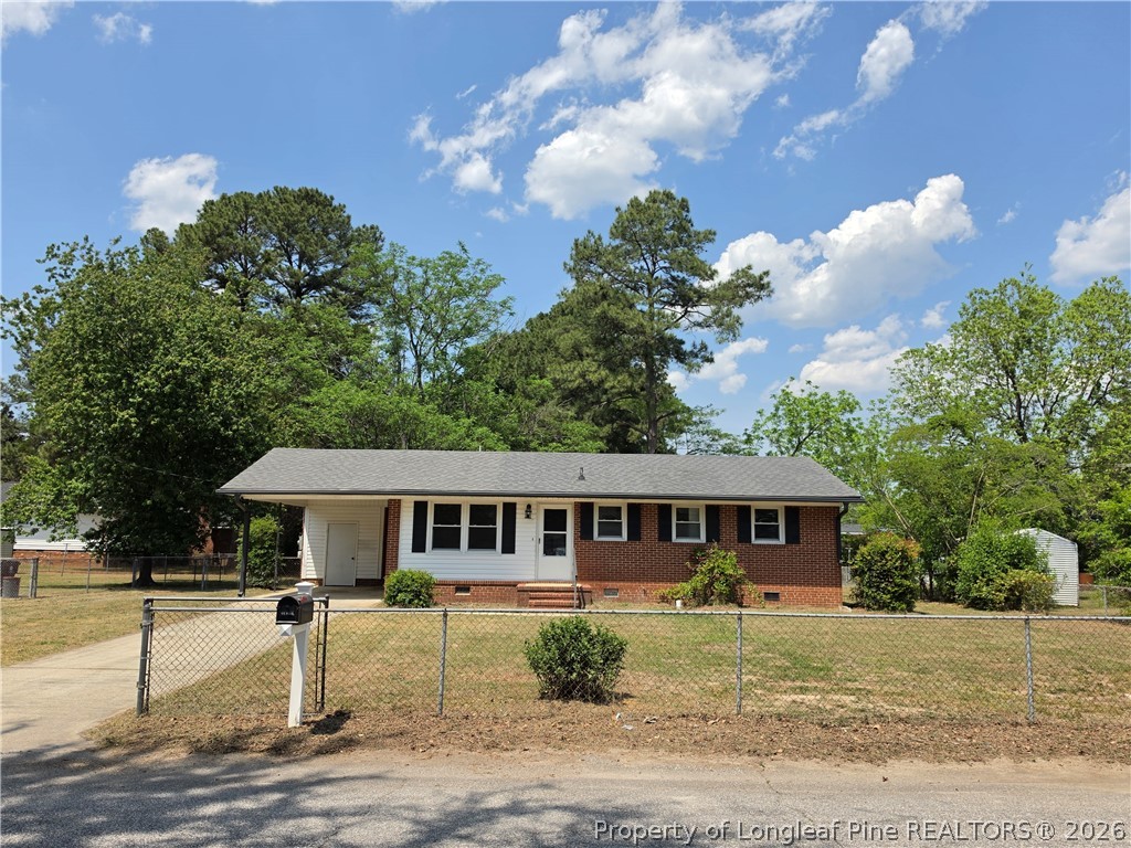 220 Cecil Avenue Spring Lake, NC 28390 - Photo 21 of 21 a front view of a house with garden