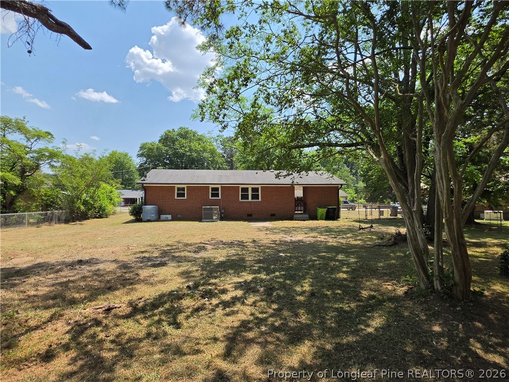220 Cecil Avenue Spring Lake, NC 28390 - Photo 4 of 21 a front view of a house with a big yard