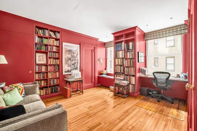 a spacious bedroom with a bed and a large window