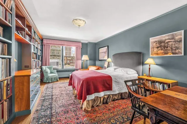 a view of front door with furniture and a window