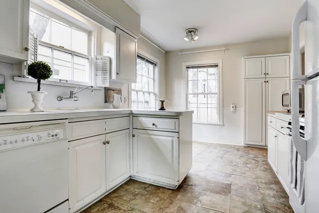 a kitchen with a sink stove and refrigerator