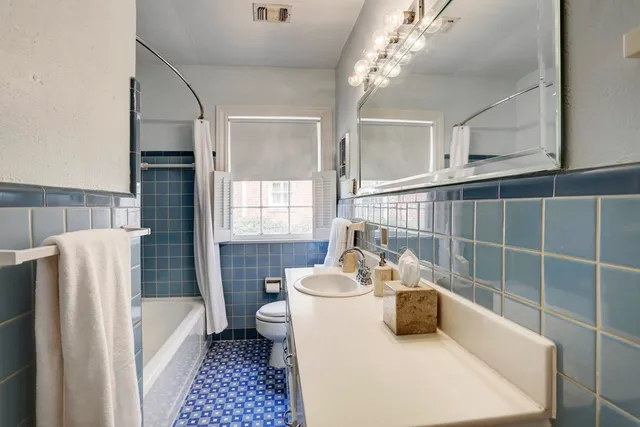 a bathroom with a sink a bathtub and a shower