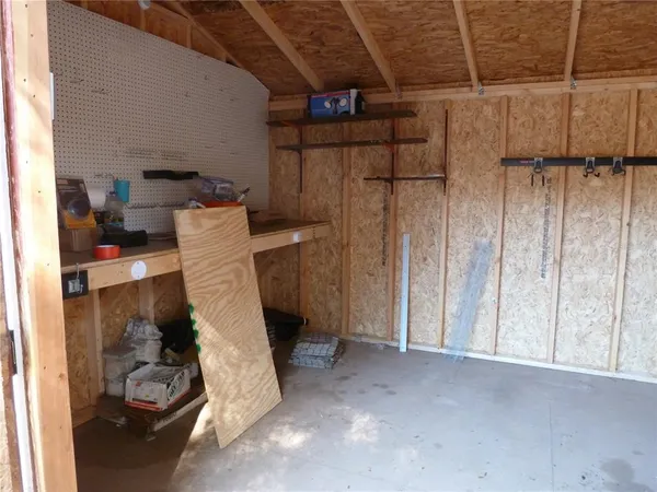 a view of storage and utility room with a sink