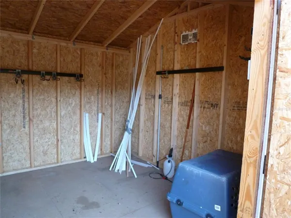 a view of a room with windows and stairs
