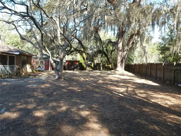 a view of outdoor space with deck and tree