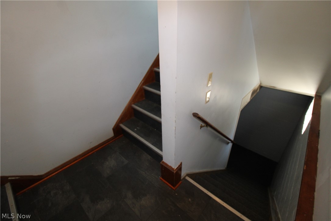 18800 Neff Road Cleveland, OH 44119 - Photo 31 of 38 Stairs featuring dark wood-type flooring