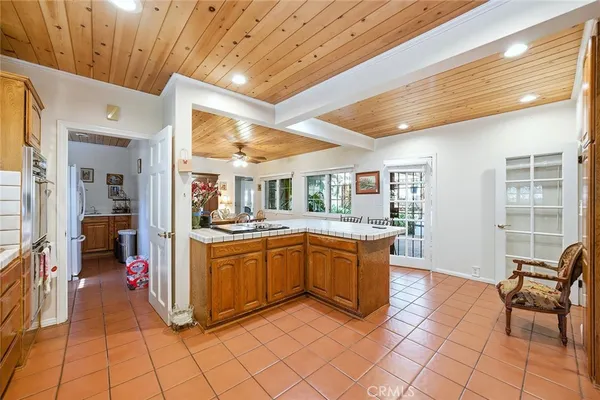 a kitchen with stainless steel appliances granite countertop a sink and cabinets