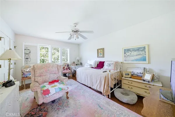 a bedroom with bed and a window