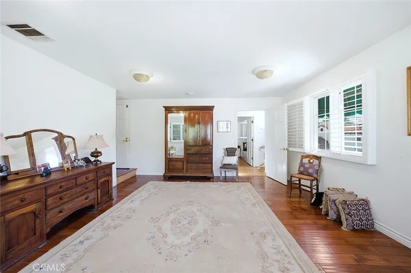 a bed room with furniture and a window