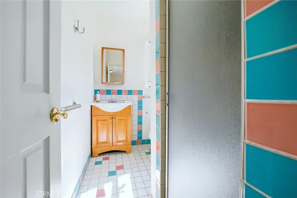 a hallway with a door and a couch