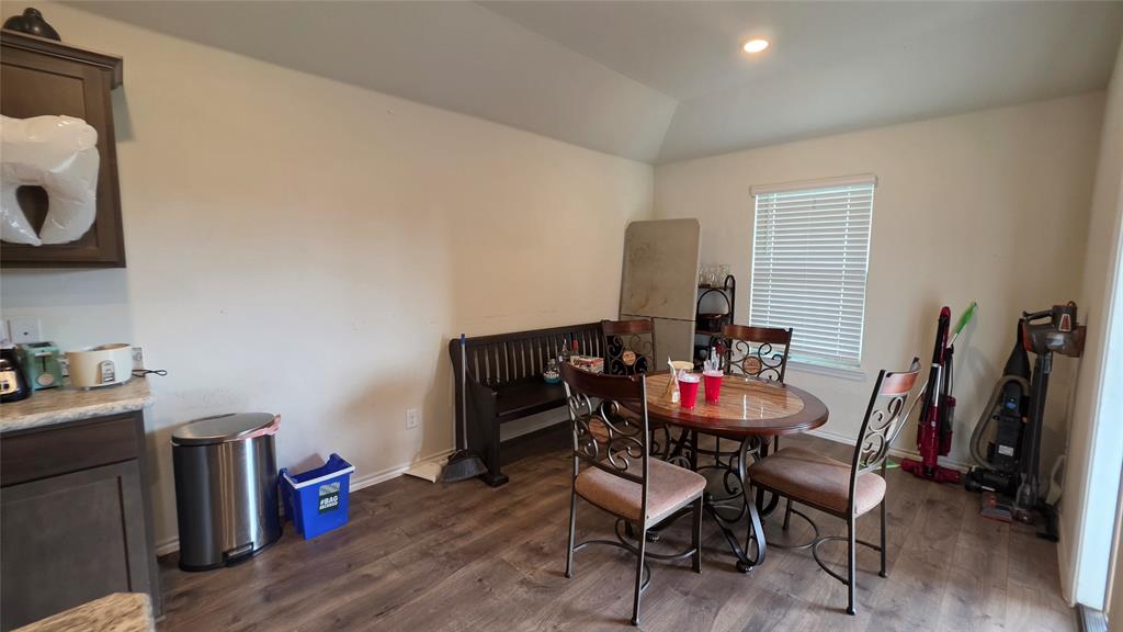 409 Samuel Street Denton, TX 76207 - Photo 20 of 40 a dining room with furniture and wooden floor