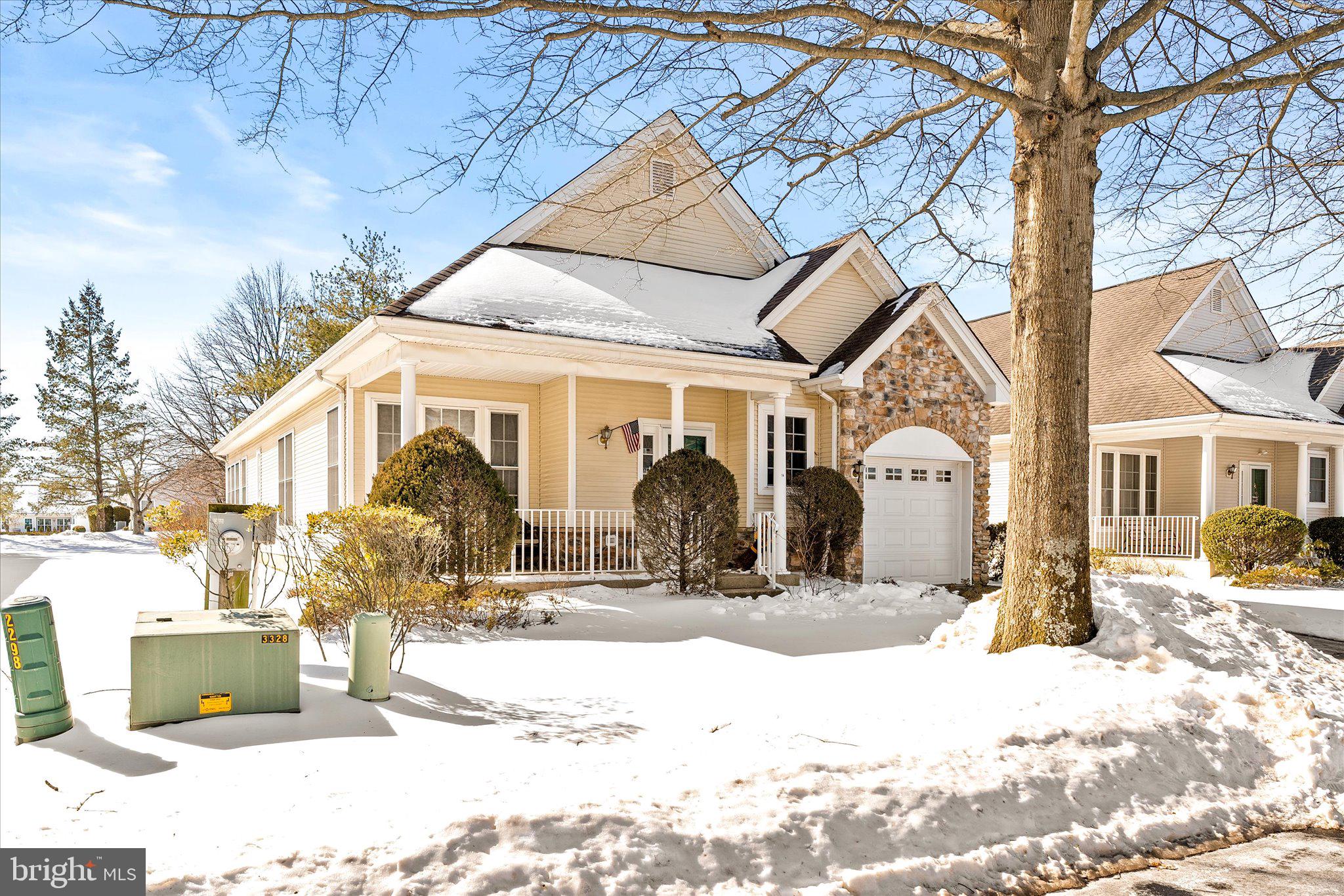 a view of a house with snow on the road