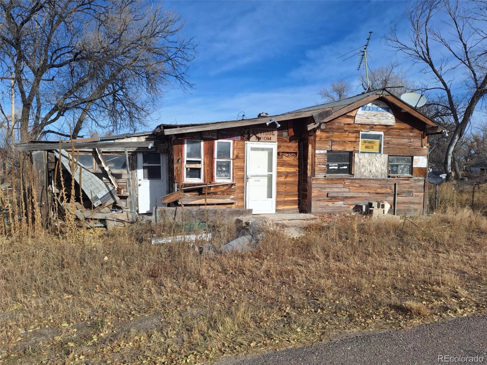 37025 Highway 24 Matheson, CO 80830 - Photo 12 of 13 a front view of a house with garden