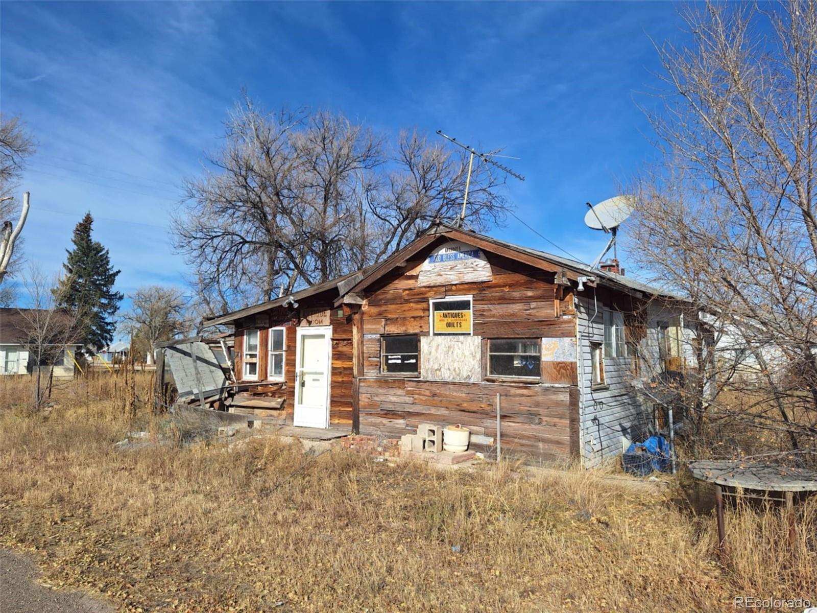 37025 Highway 24 Matheson, CO 80830 - Photo 2 of 13 a front view of a house with a yard