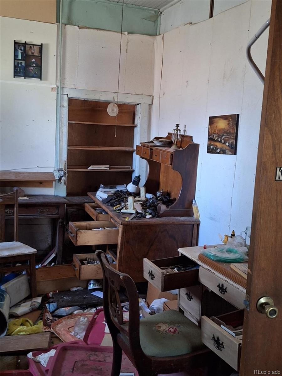 37025 Highway 24 Matheson, CO 80830 - Photo 7 of 13 a room with furniture and musical instruments