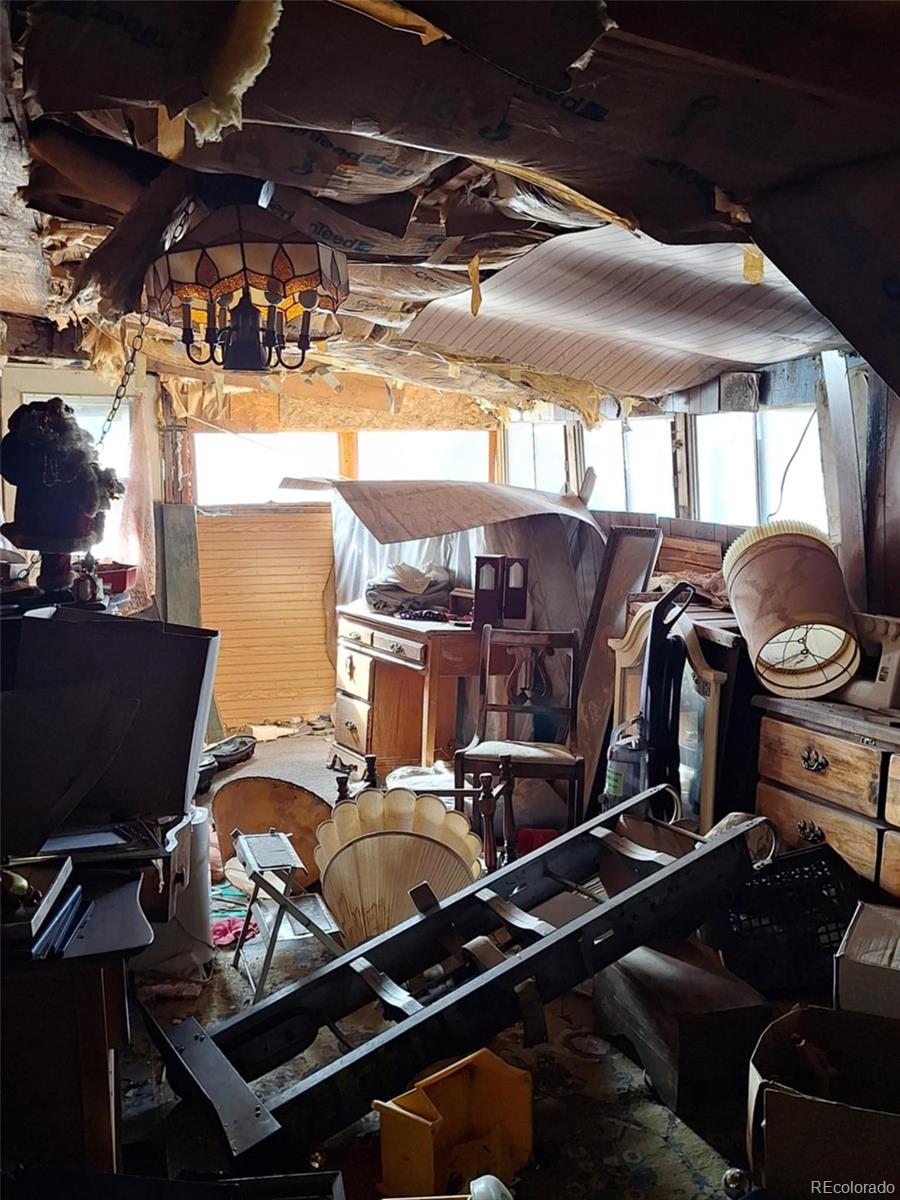 37025 Highway 24 Matheson, CO 80830 - Photo 9 of 13 a roof deck with table and chairs