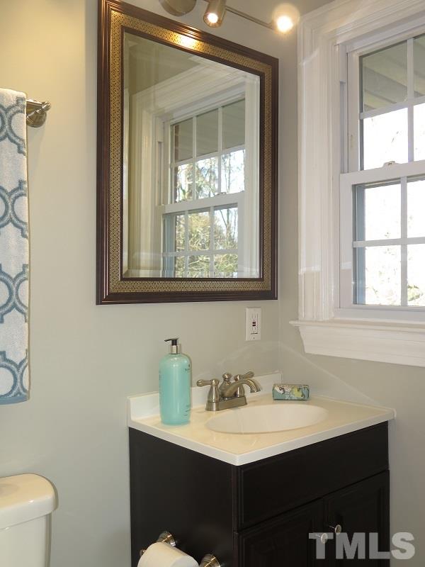 711 St George Road Raleigh, NC 27610 - Photo 11 of 19 a bathroom with a sink and a toilet