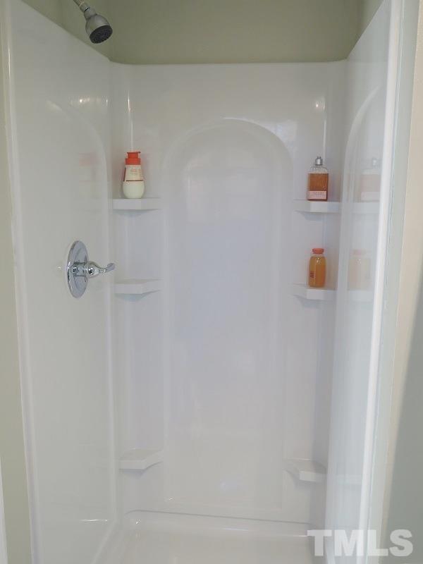 711 St George Road Raleigh, NC 27610 - Photo 12 of 19 a bathroom with a shower
