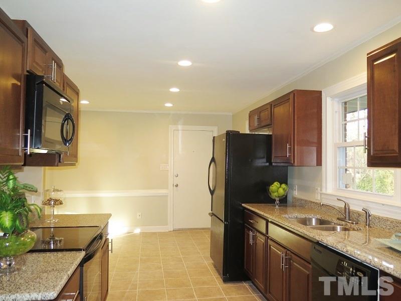 711 St George Road Raleigh, NC 27610 - Photo 9 of 19 a kitchen with stainless steel appliances granite countertop a refrigerator and a sink