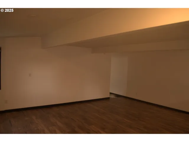 a kitchen with kitchen island granite countertop a sink cabinets and stainless steel appliances