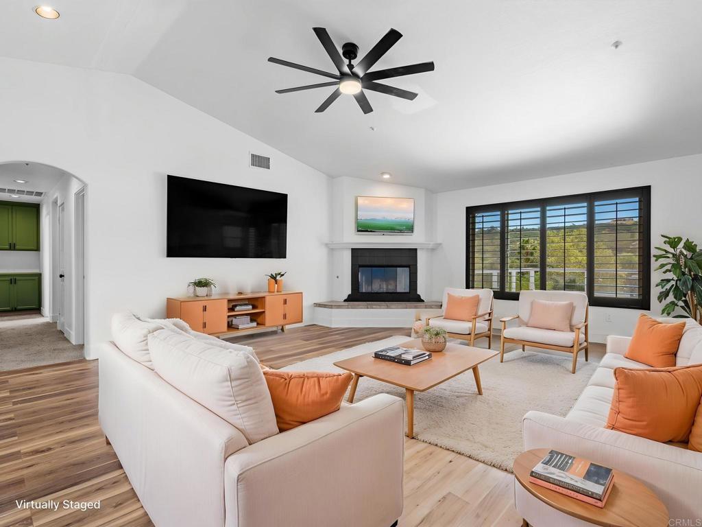 24719 Pappas Road Ramona, CA 92065 - Photo 1 of 1 a living room with furniture a flat screen tv and a fireplace